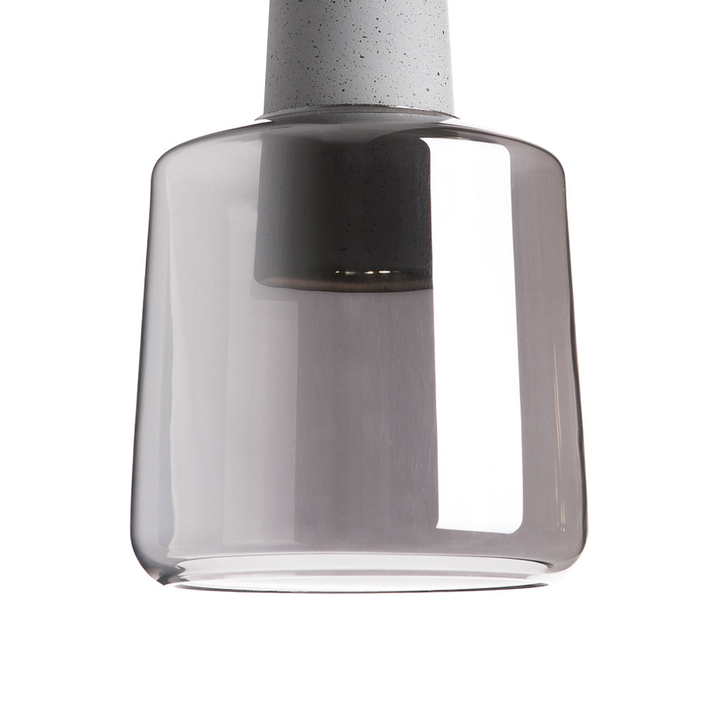 Suspension LED en métal avec base en béton et cylindre en verre