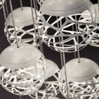 Suspension LED boule de verre en métal découpé au laser